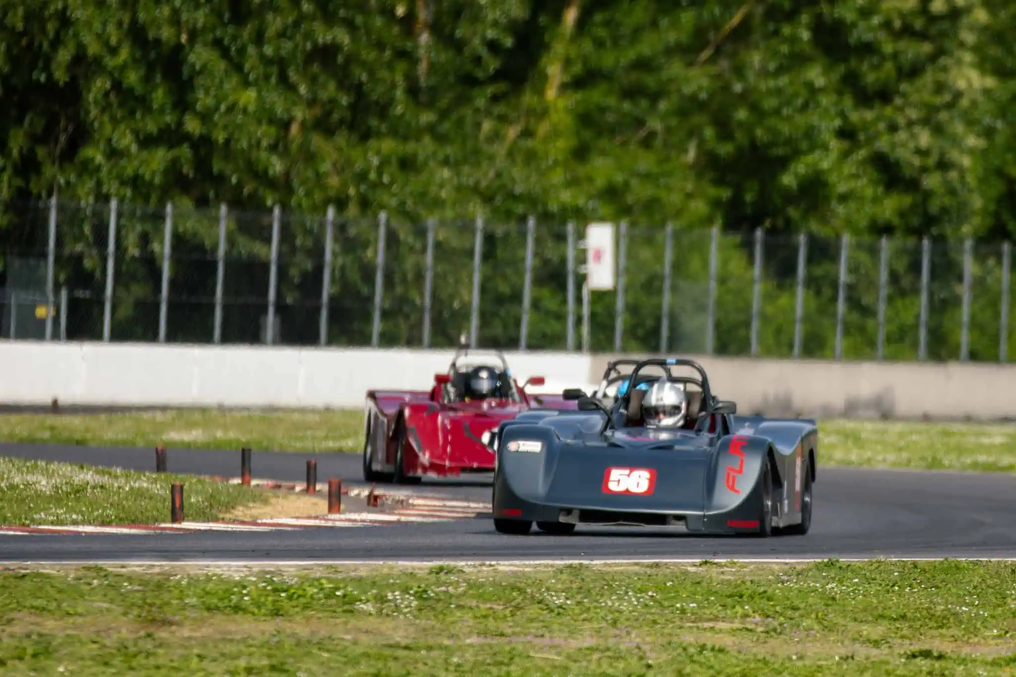 Ron Tanemura driving a black Spec Racer Ford Gen3 through Portland International Raceway during an SCCA race weekend.