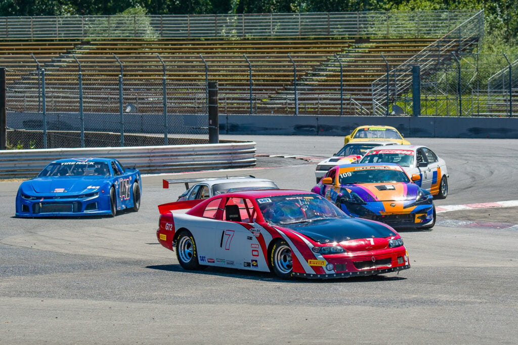 Gama Aguilar bombing through T1 at Portland International Raceway in his Nissan 370Z Nismo.