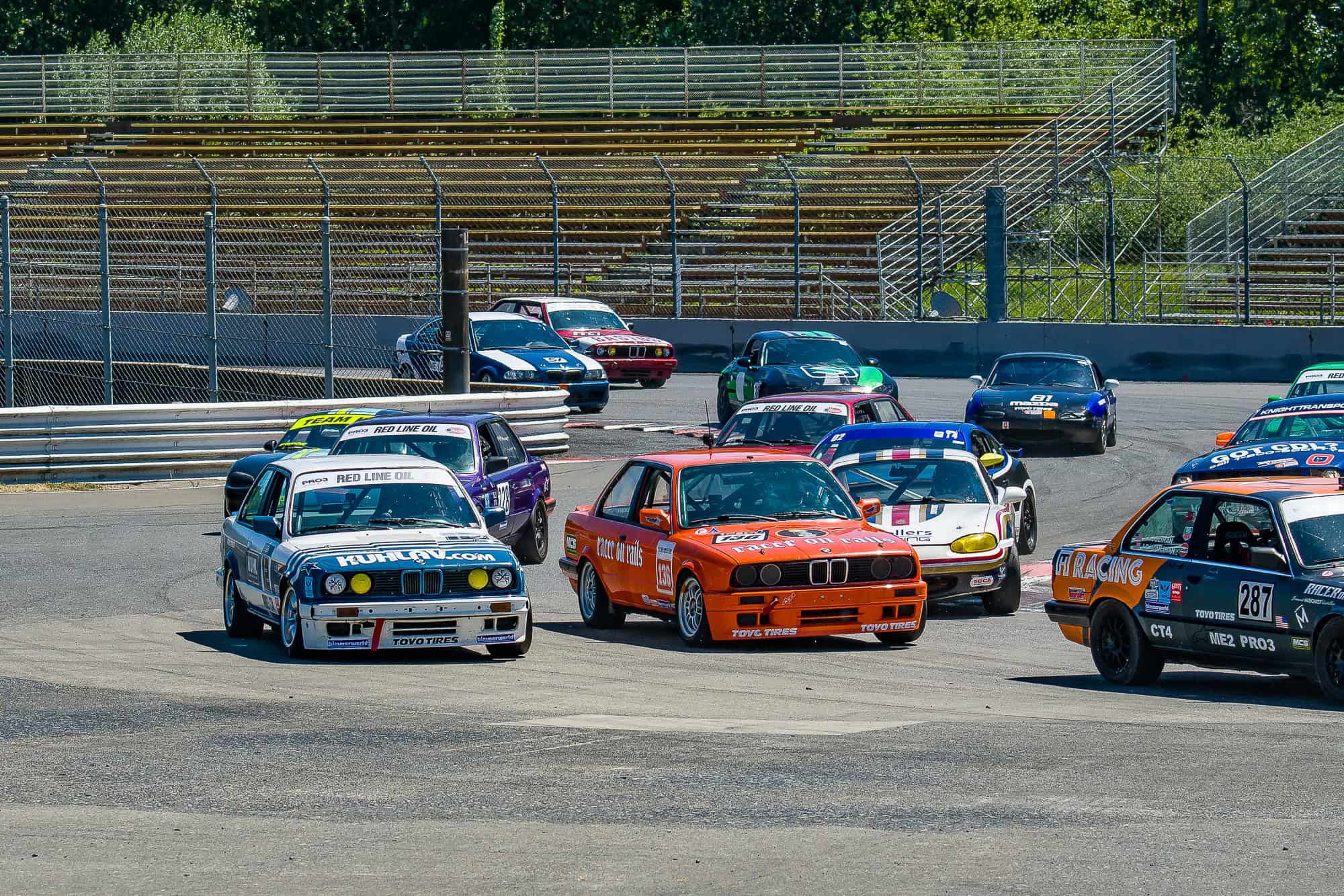 Ron Tanumera driving through the PIR festival chicane in the Racer on Rails BMW PRO3 race car.