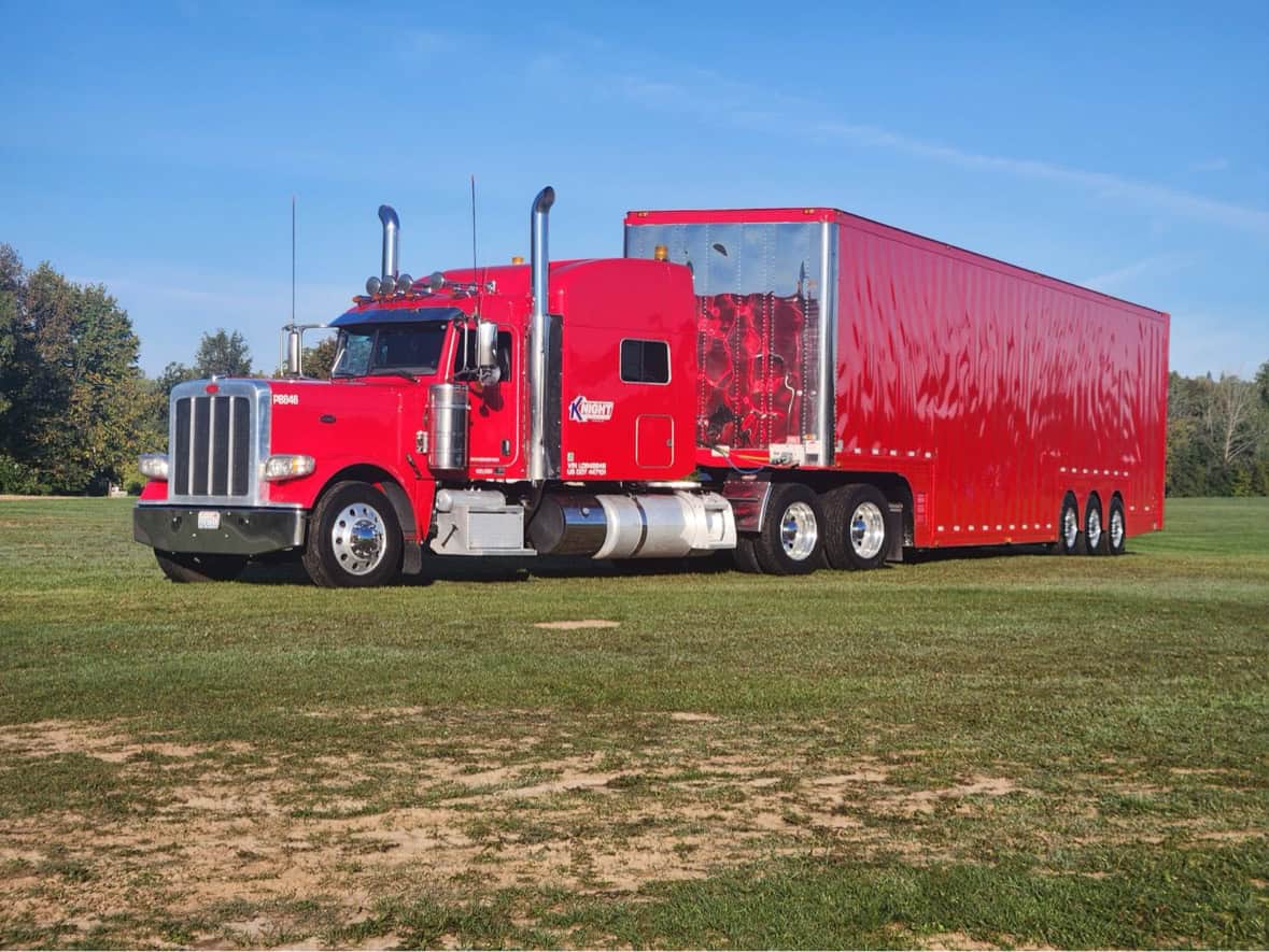 The red Knight Transport truck and trailer at Road America