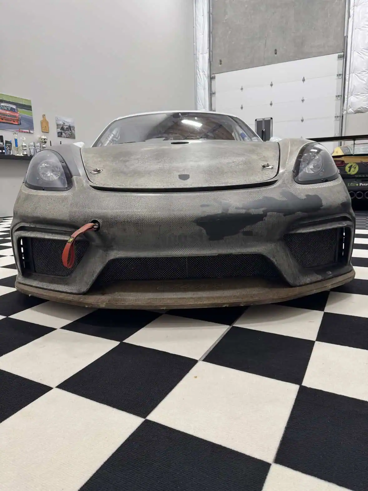 718 Cayman GT4 Clubsport MR with raw unpainted carbon front clip