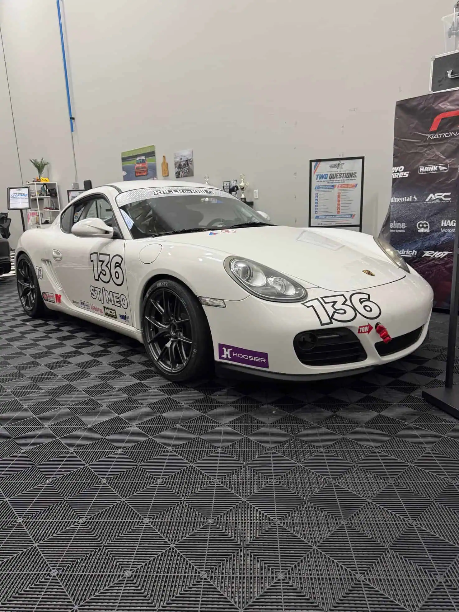 Dirk's 2010 Porsche Cayman T3 race car #136 in the Racer on Rails showroom